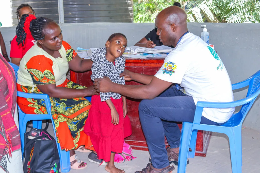 Community members participating in Jomvu outreach